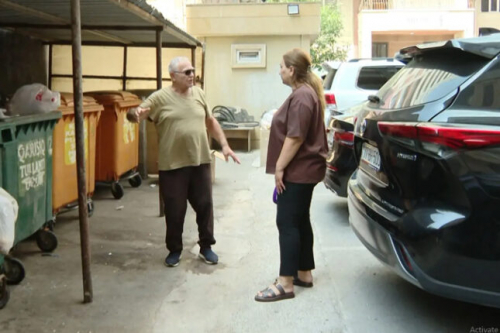 MTK zibil konteynerlərini evinin pəncərəsinin qarşısında yerləşdirib